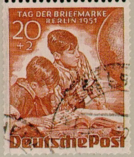 Boys with stamp album & globe