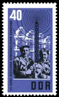 Workers with microphone transmitter mast chemical plant