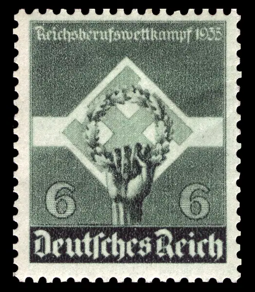 hand holding wreath & swastika