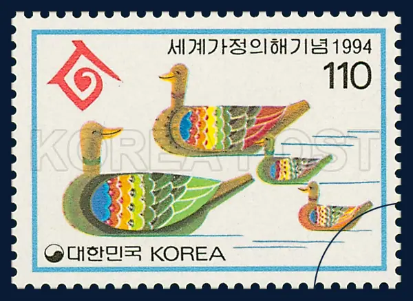 a ahppy family represented by mandarin dusks Single stamp