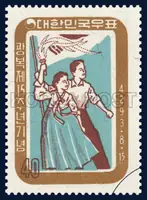 Man with the national flag and woman with a torch