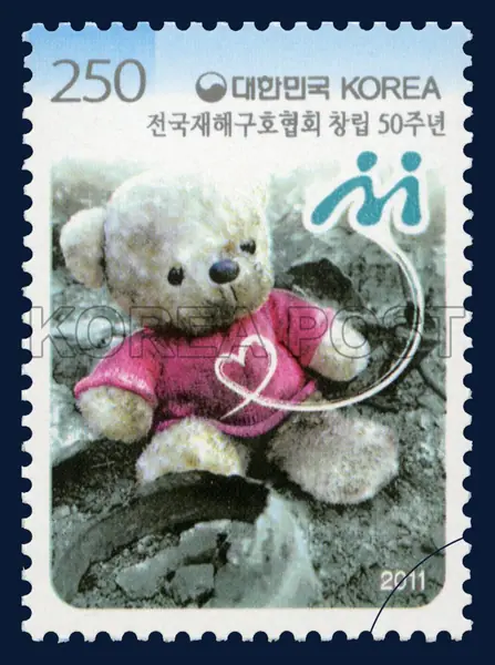 Teddy bear at the disaster site Single stamp