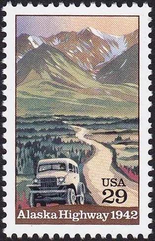 Truck on Alaska Highway with Mountains in Background